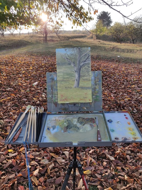 Autumn withered tree painting on easel