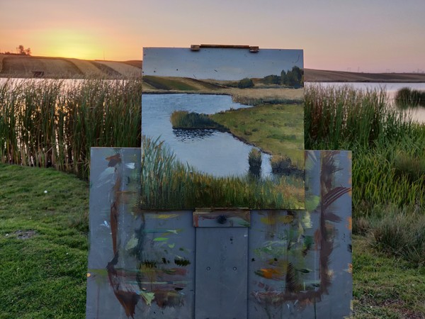 Lake landscape painting on easel