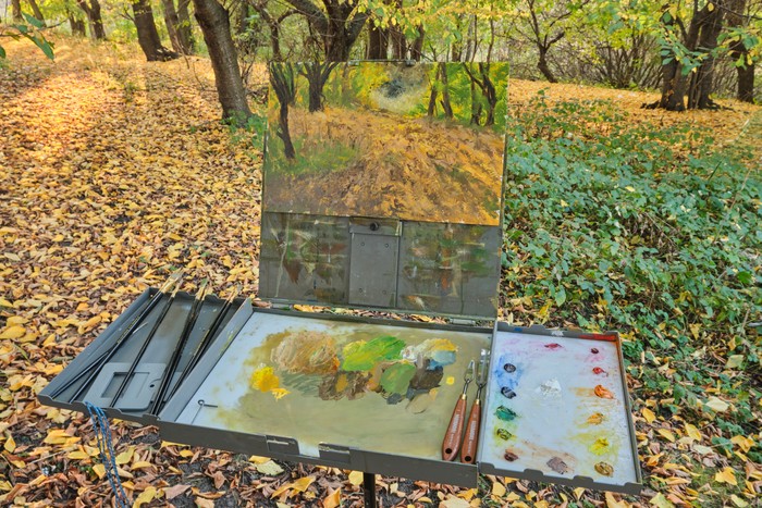 Golden leaves autumn landscape painting on easel